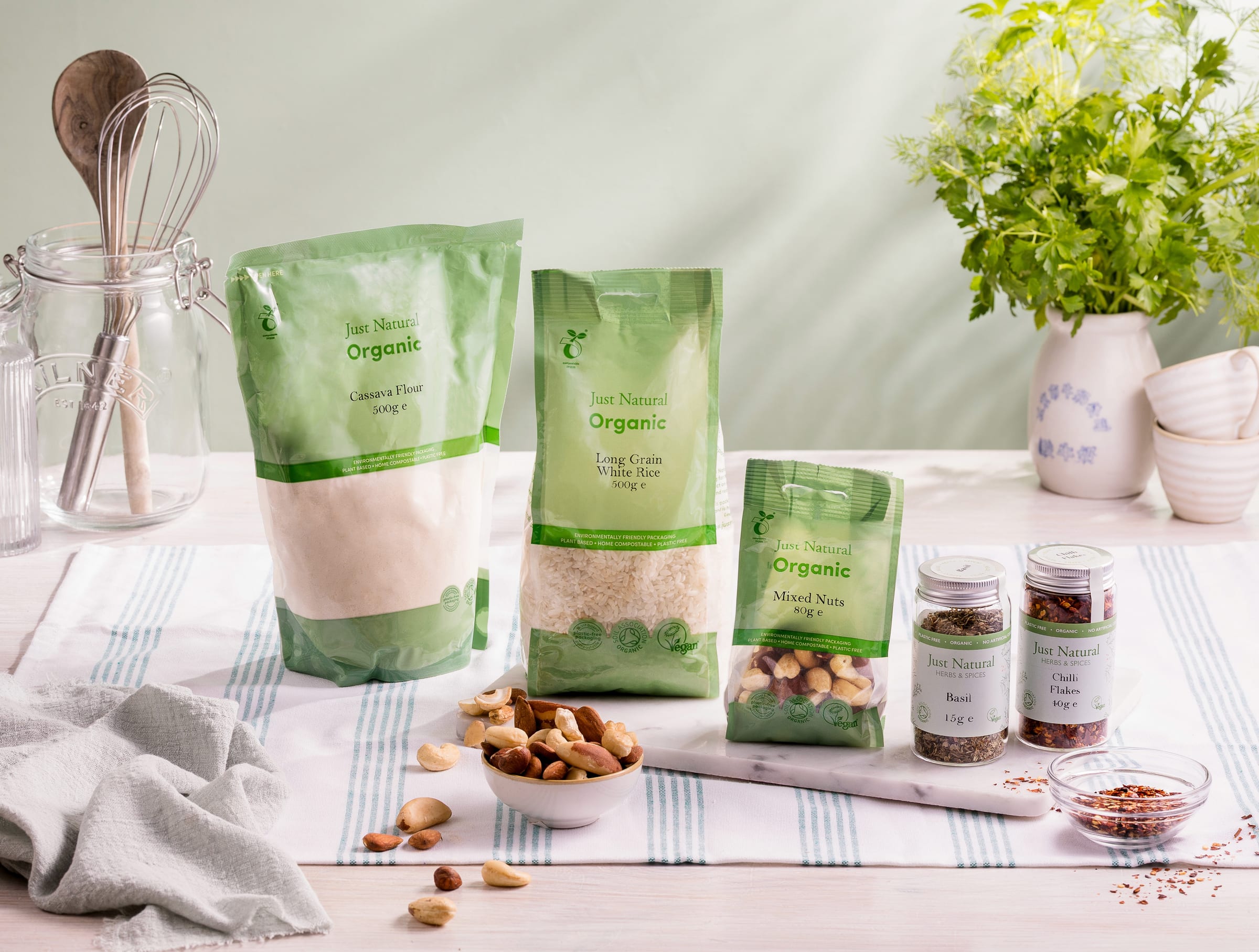 Just Natural organic ingredients and spices arranged on a kitchen surface.