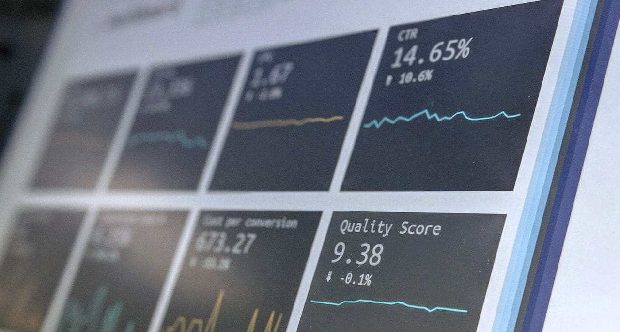 A performance dashboard on a screen, with click-through rate and cost per conversion tiles